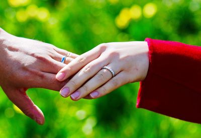 Close-up of couple holding hands