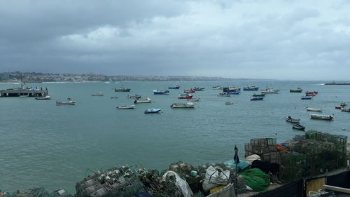 High angle view of harbor by sea against sky