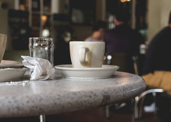 Close-up of coffee served on table at cafe