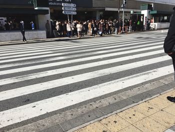 People walking on zebra crossing