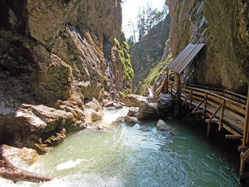 Scenic view of river flowing through rocks