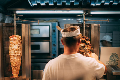 Rear view of man working in restaurant