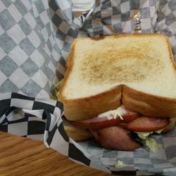 Close-up of cat relaxing on tiled floor