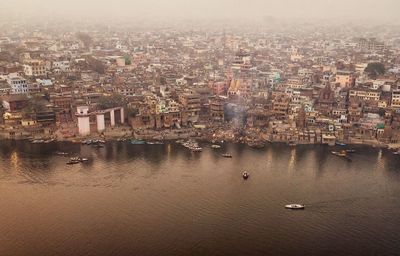 High angle view of river amidst buildings in city