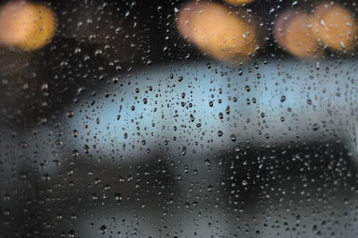 Full frame shot of wet glass window during rainy season