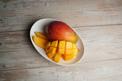 High angle view of fruits in plate on table