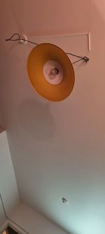 Low angle view of pendant light hanging from ceiling