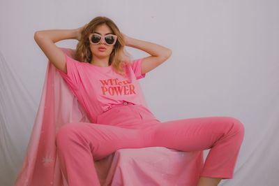 Portrait of young woman in sunglasses