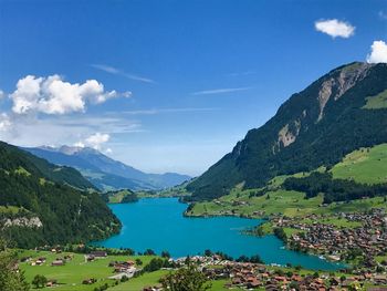 Scenic view of mountains against blue sky