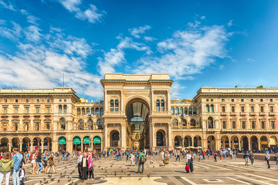 Group of people in front of historical building