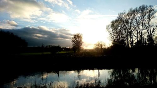 Scenic view of lake at sunset