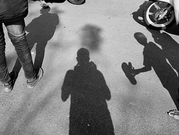 Black and white shadow of people and family walking in the morning 