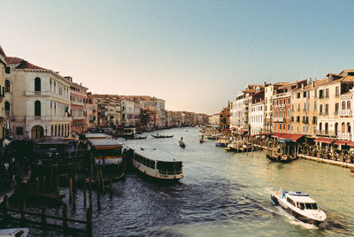 Boats in grand canal against sky