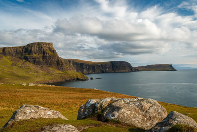 Scenic view of sea and mountains against sky