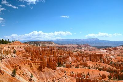 Scenic view of landscape against blue sky