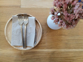 High angle view of white roses on table