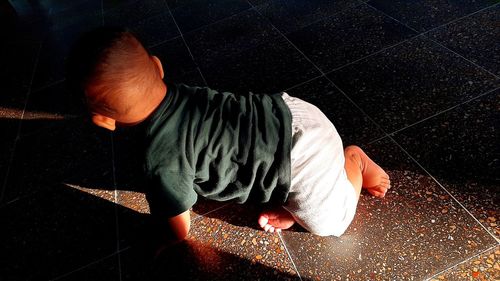 High angle view of man working on floor