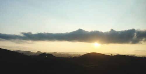 Scenic view of silhouette mountains against clear sky