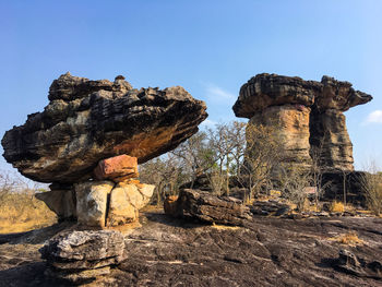 Low angle view of rock formation against clear sky