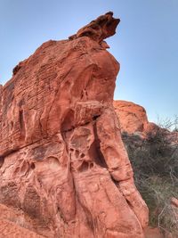 Rock formations on landscape against clear sky