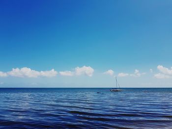 Scenic view of sea against blue sky