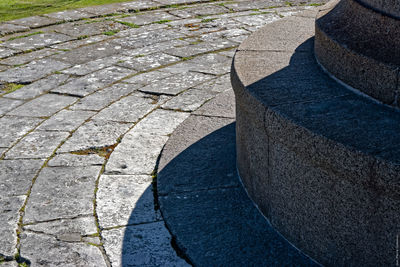 Cropped image of lighthouse by paving walkway