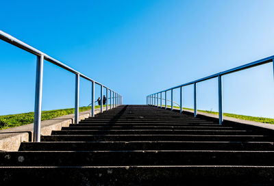 Low angle view of bridge against clear blue sky