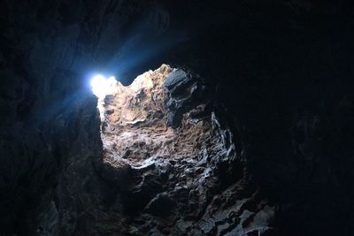 Low angle view of illuminated cave