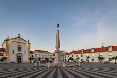 View of buildings in city against sky