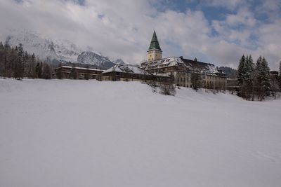 Snow covered cathedral against sky