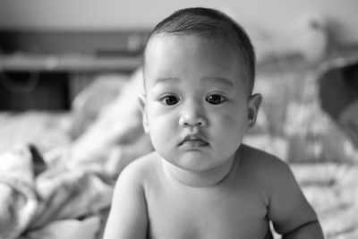 Portrait of cute shirtless baby girl