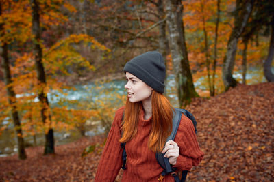 Young woman looking away outdoors
