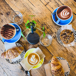 High angle view of coffee and pastries on table