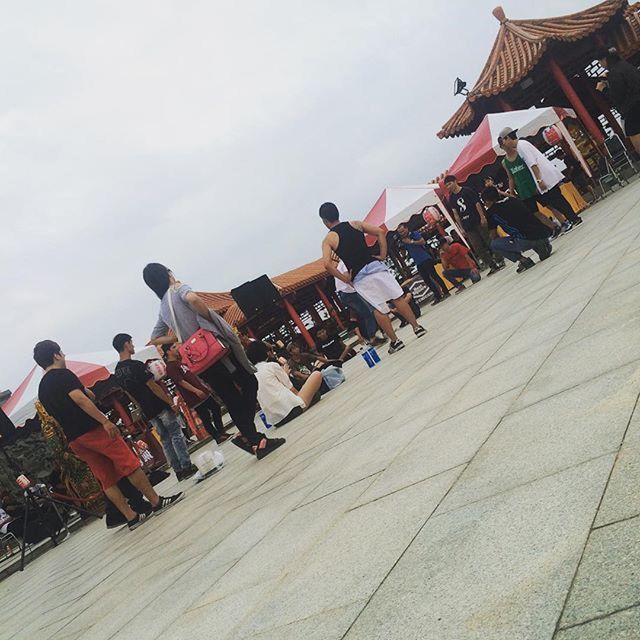 large group of people, men, lifestyles, leisure activity, person, cultures, tradition, low angle view, sky, built structure, building exterior, architecture, day, fun, outdoors, enjoyment, mixed age range, arts culture and entertainment, flag