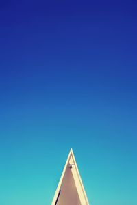 Low angle view of building against clear blue sky