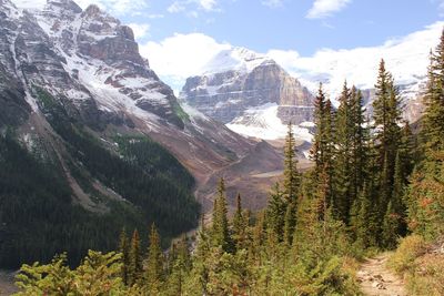 Scenic view of mountains against cloudy sky