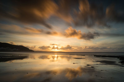 Scenic view of sea against sky at sunset