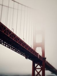 Low angle view of suspension bridge against sky in san francisco