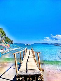 Scenic view of sea against blue sky