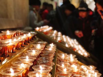 High angle view of illuminated candles in church