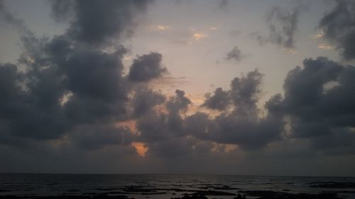 Scenic view of sea against cloudy sky