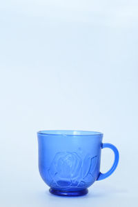 Close-up of coffee cup against white background