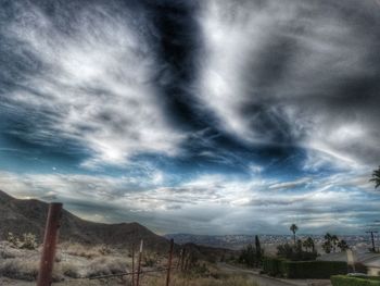 Scenic view of landscape against cloudy sky