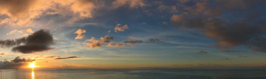 Scenic view of sea against sky at sunset