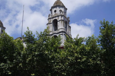 Low angle view of bell tower against sky