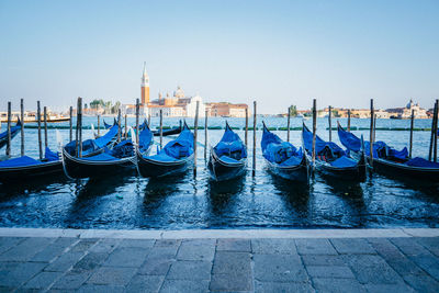 Boats moored in water