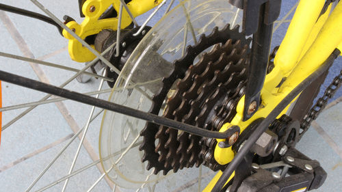 High angle view of yellow bicycle wheel