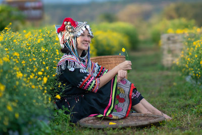 Full length of woman holding umbrella