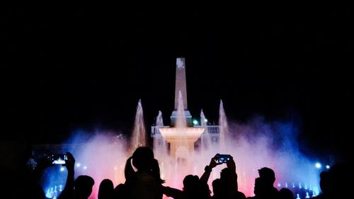 People photographing at night
