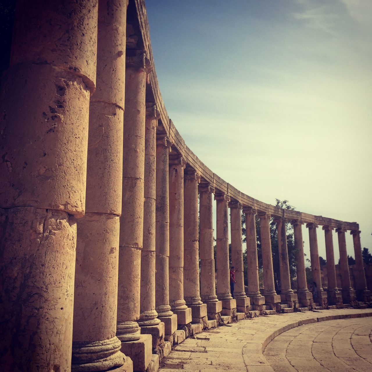 architecture, built structure, history, ancient, architectural column, old ruin, ancient civilization, the past, famous place, in a row, building exterior, colonnade, old, travel destinations, column, sky, tourism, low angle view, travel, arch